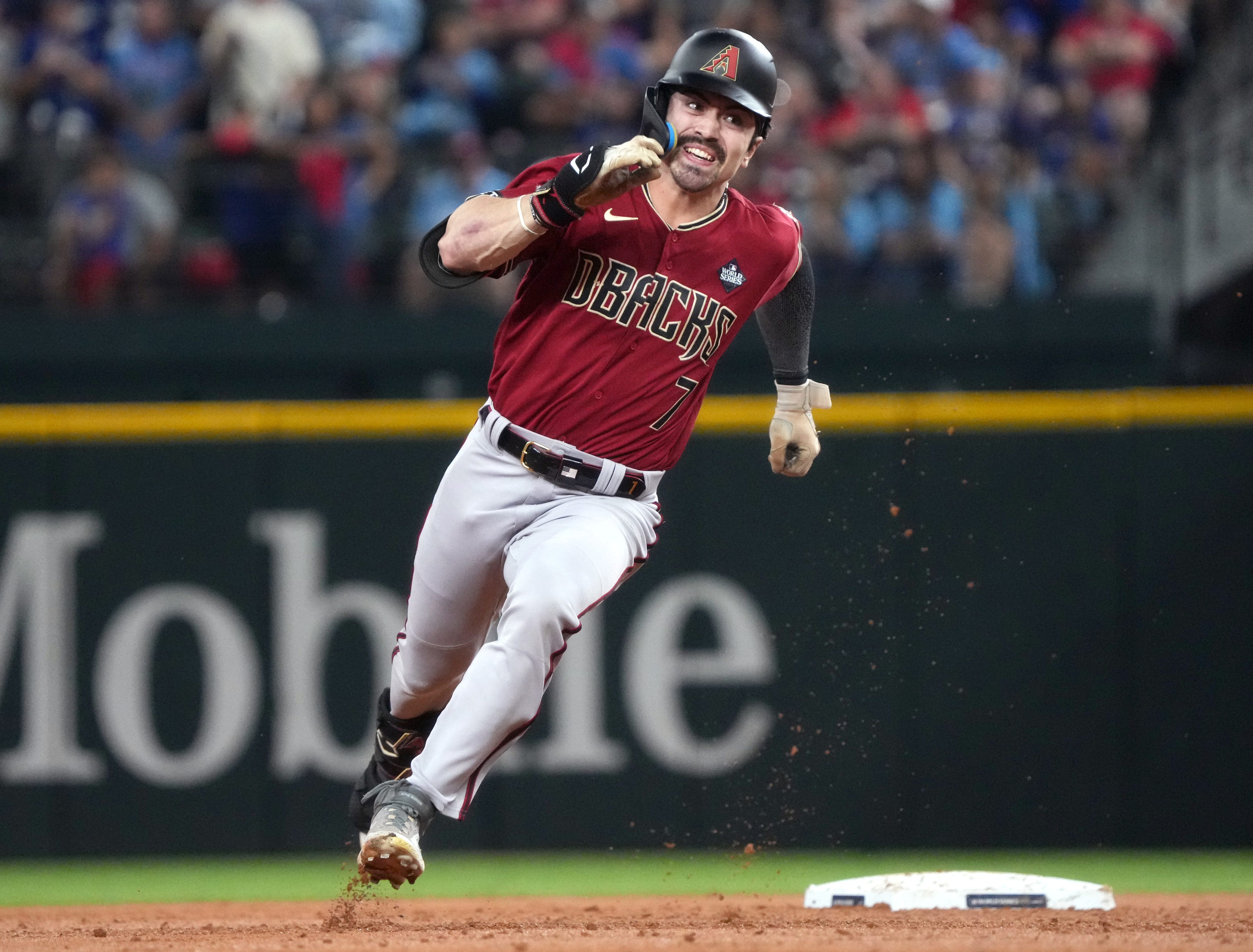 Oct 27, 2023; Arlington, Texas, USA; Arizona Diamondbacks outfielder Corbin Carroll (7) rounds second base against the Texas Rangers during Game 1 of the World Series at Globe Life Field.
